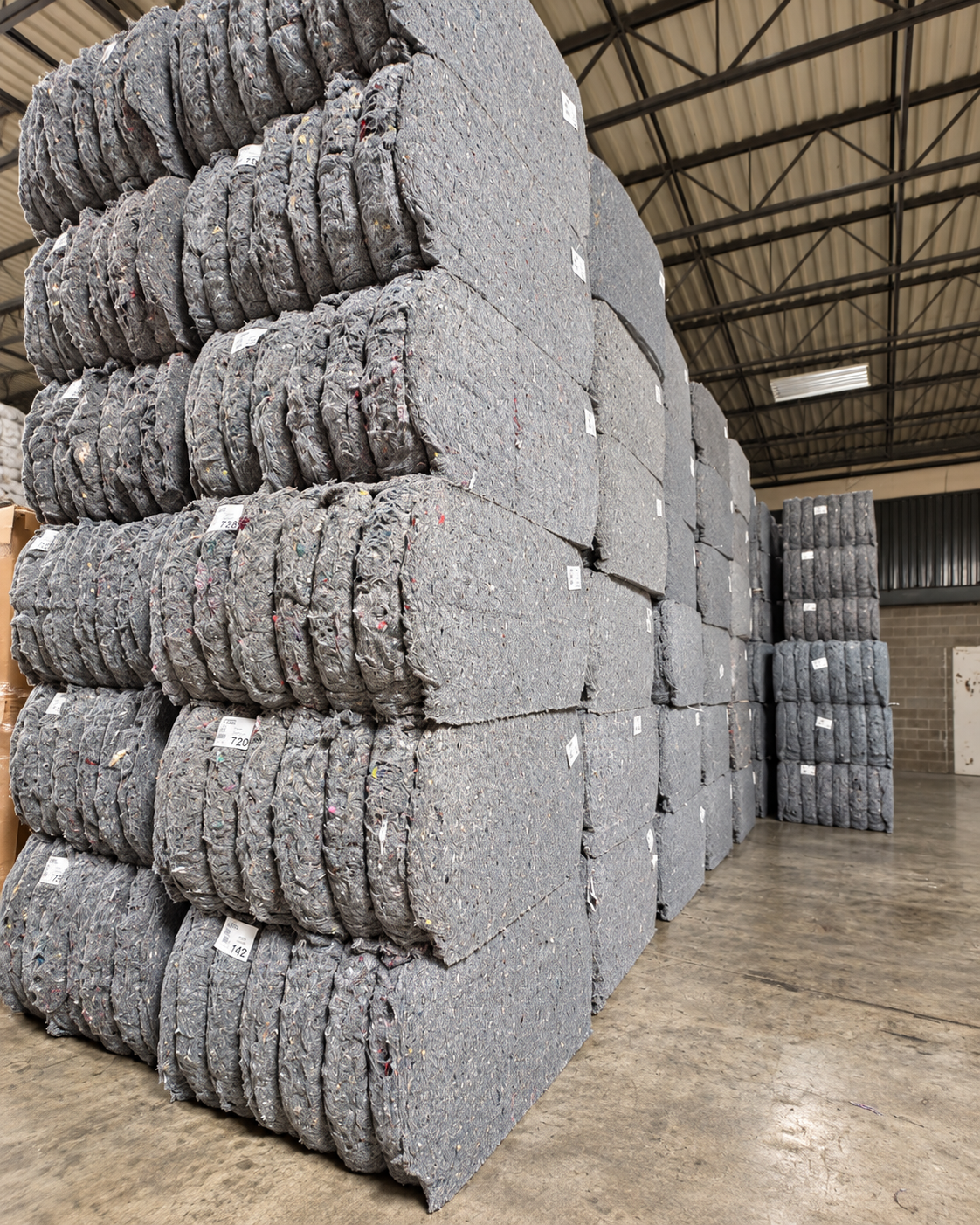Bales of mixed recovered textiles awaiting their next use